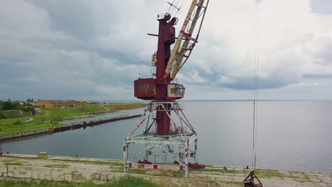 an old abandoned rusty crane in the seaport 05