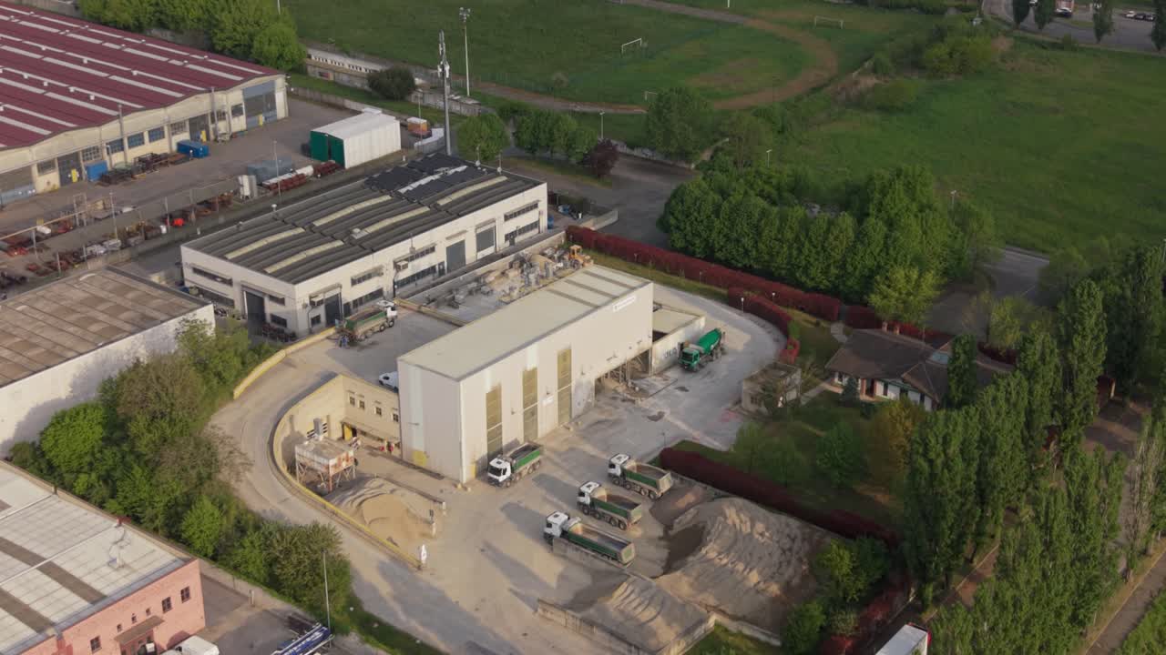 Aerial view of a concrete production plant in the Milan area, Italy. Industrial facility supplying ready-mix concrete for construction and infrastructure development projects