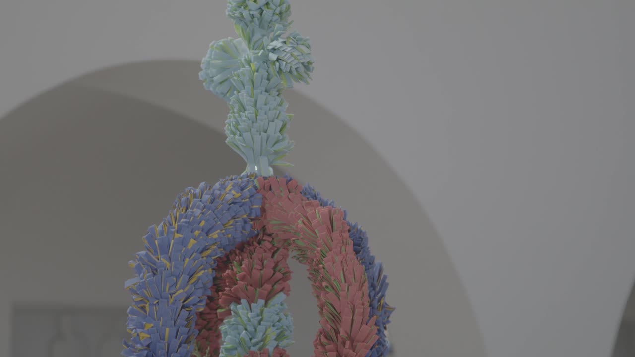 Self-made colorful palm stick, placed next to an ambo in a church