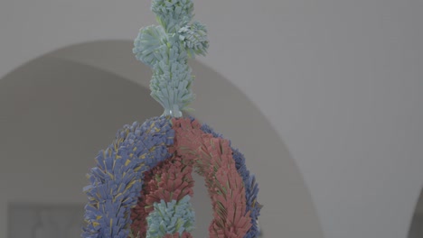 self-made colorful palm stick, placed next to an ambo in a church