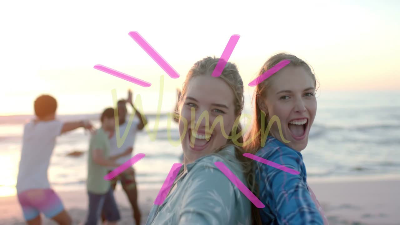 Two women on beach raising arms causing Women overlay, leaning to camera, creating closeup for ads