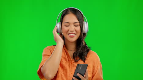 Phone,-radio-headphones-and-woman-on-green-screen