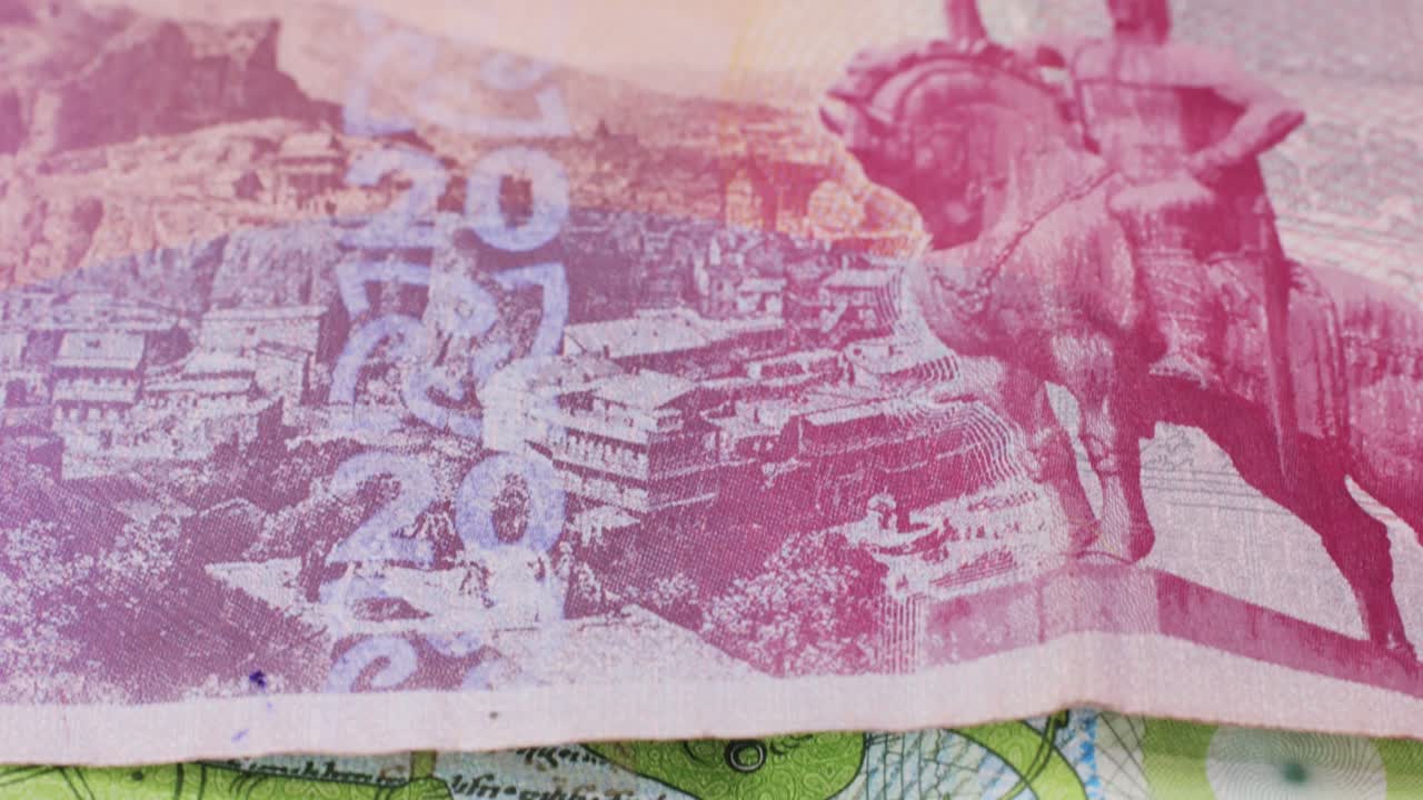 Five Georgian lari banknotes close-up. Universal currency converter GEL Central Bank. 5 lari paper money macro. Economy, financial and banking concept .