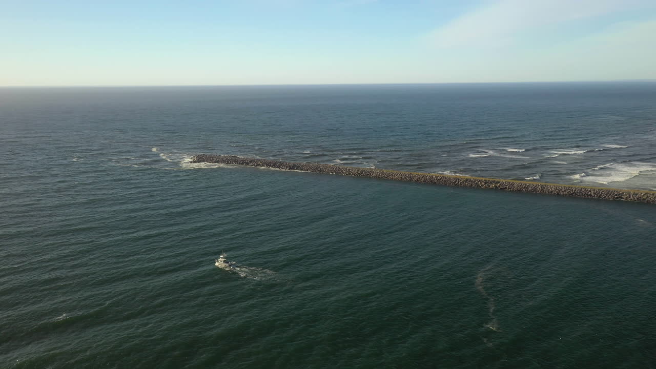 Coastguard boat leaving the bay for the open ocean near Coos Bay, Oregon