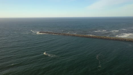 coastguard boat leaving the bay for the open ocean near coos bay, oregon