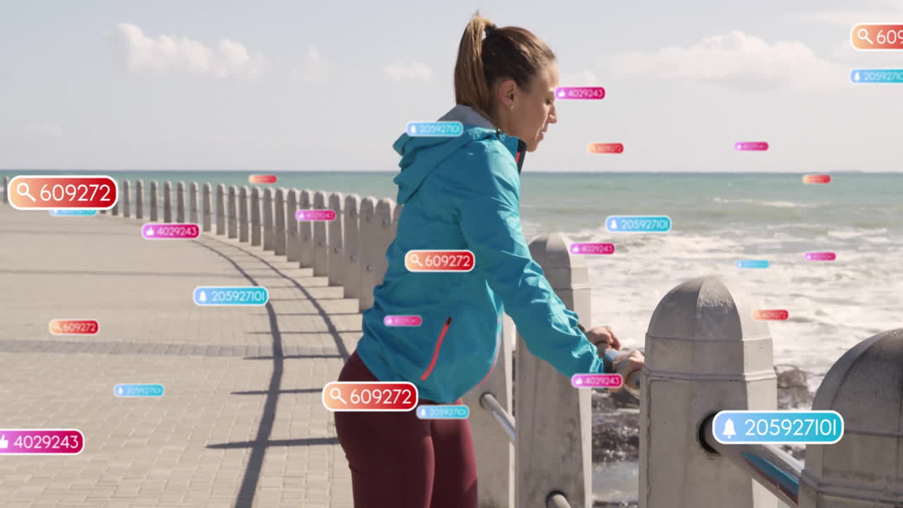 Leaning on railing by ocean, woman surrounded by data points animation