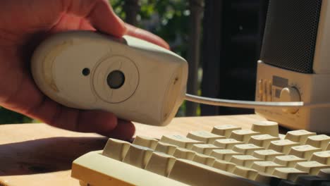 man working and gaming on retro computer pc, it engineer with vintage computer at home, using old fashion technology, close up of retro setup.