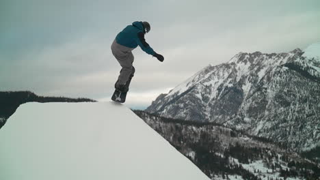 snowboarder method air jump woodward copper mountain ski snowboard resort winter training olympics competition grey bird fresh snow scenic landscape vail aspen x games slow motion cinematic pan follow