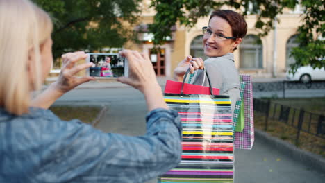 Two women shopping and taking pictures