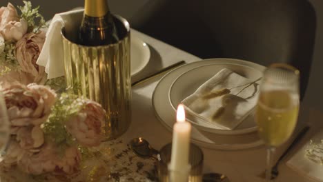 table set for meal at wedding reception with champagne in ice bucket 5