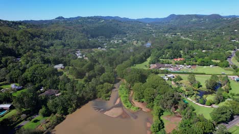 aerial view of currumbin creek and currumbin creek road in gold coast, australia