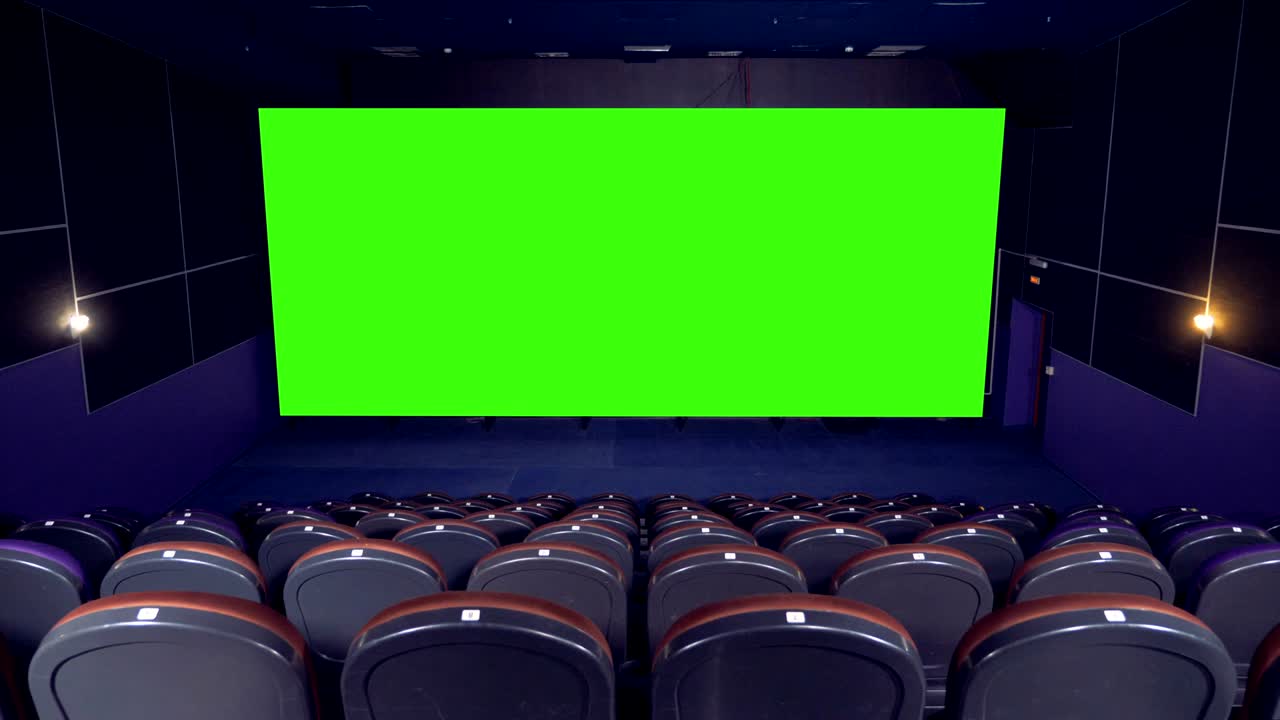Sala cinematografica con schermo verde. 4K