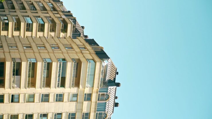 Vertical view of some balconies of a luxury apartment in Puerto Madero with the Argentine flag flying