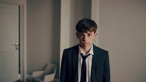 teenage boy in business suit
