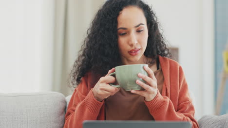 Woman,-laptop-and-coffee-on-living-room-sofa