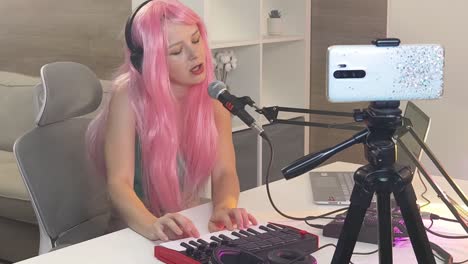 woman singing and playing keyboard during livestream