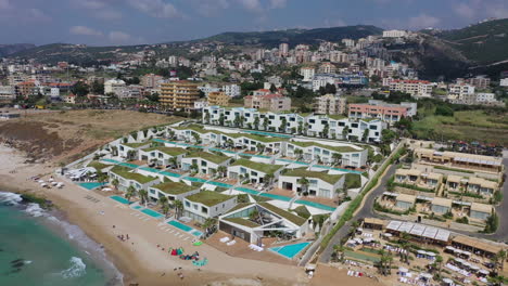 scenic aerial view of swimming pools and luxury resorts dotting the hills of batroun, lebanon