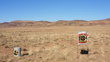 Low-altitude-backward-fight-over-two-targets-for-shooting-on-a-western-landscape-in-Norwood,-Colorado-