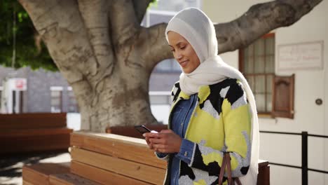 Young woman wearing hijab out and about in the city