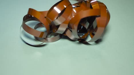 tape unreel. pulling the tape out. destroying cassette tape media. scene h