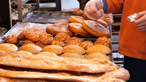 assortment of freshly baked bread and pastries at a bakery