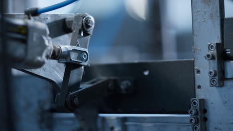Close up conveyor production process metal parts moving product machinery