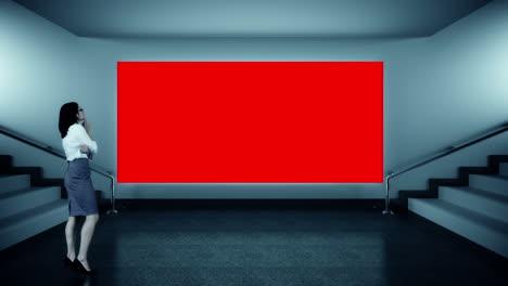 businesswoman looking at red screen