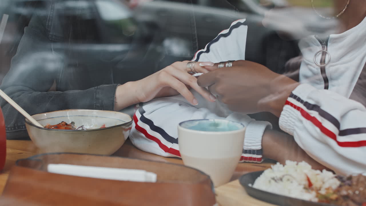 Multi-Ethnic Lesbian Couple in Cafe