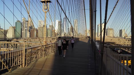 brooklyn bridge pedestrian promenade is always bustling, offering a mix of new yorkers and visitors alike