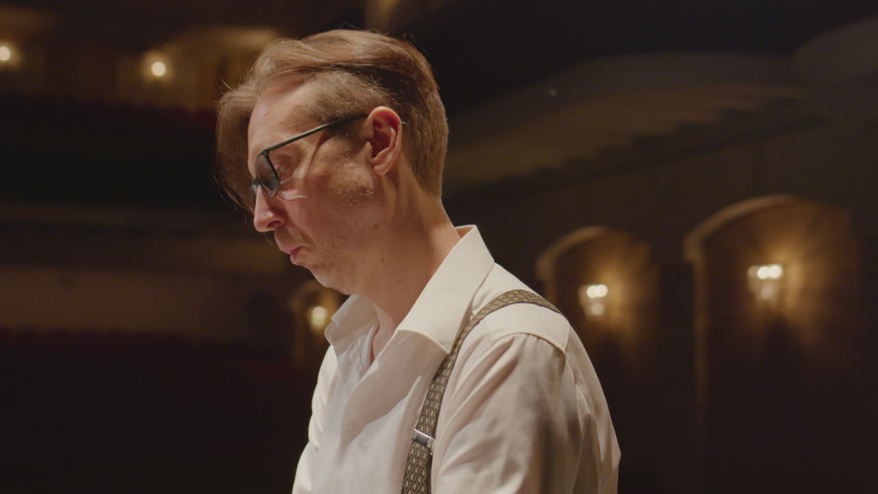Pianist Performing Music on Grand Piano