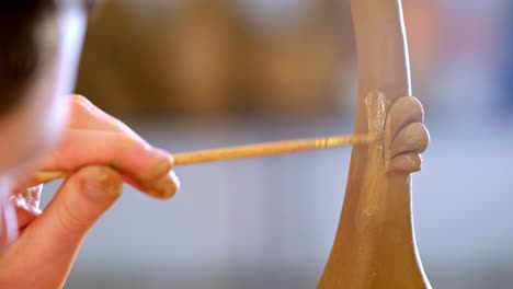 crafting artistry: the intricate process of shaping clay by hand through skilled techniques in modern ceramics
