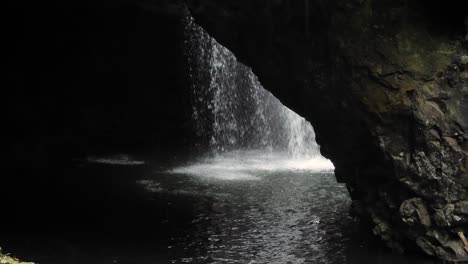 View-of-the-waterfall-in-Natural-Bridge,-Springbrook-National-Park,-Gold-Coast-Hinterland,-Australia