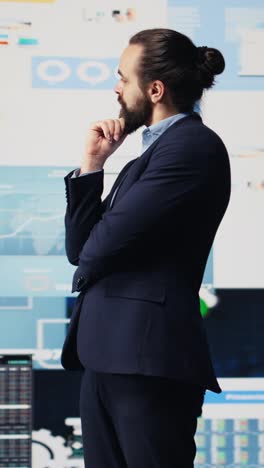 vertical video businessman thinking about a new solution to increase funding