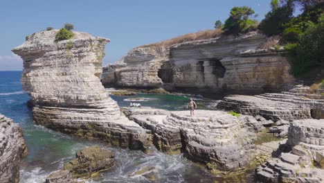 Free-young-man-walking-on-cliffs.