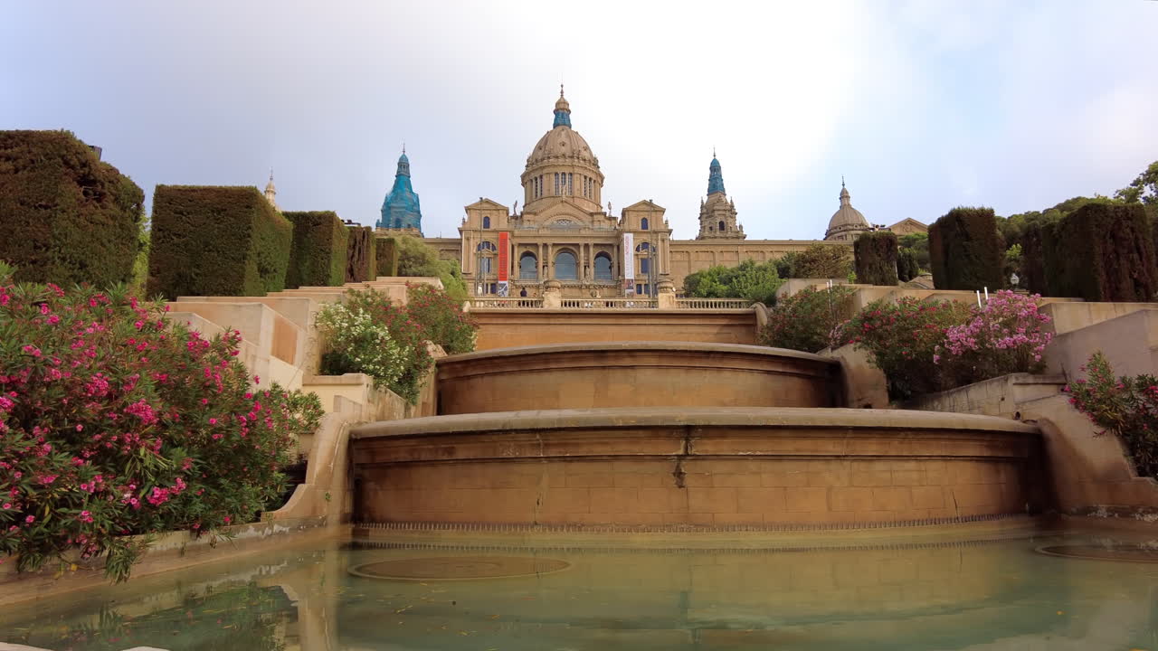 View of a fountain in front of the Montjuic National Palace in Barcelona, Spain