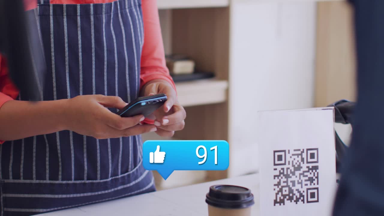 Server placing cup, tapping POS at cafe counter, likes rising around QR while completing payment