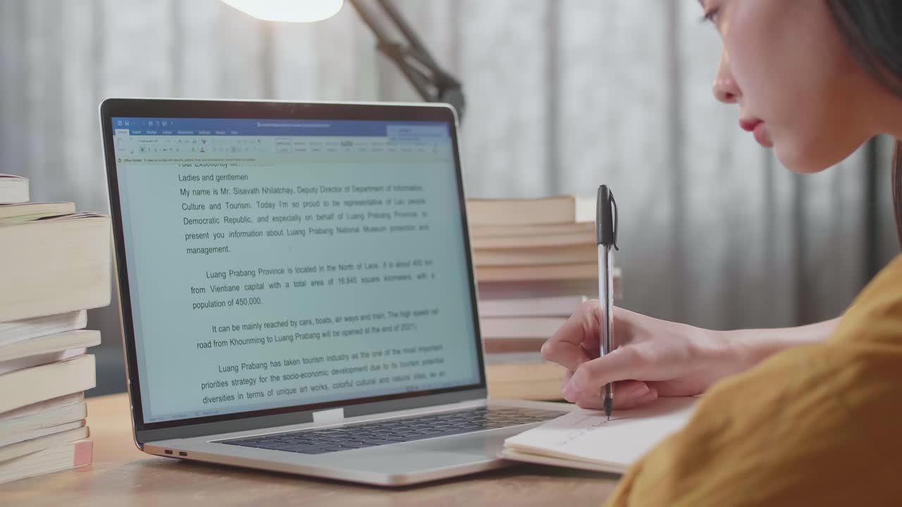 Woman Studying at Laptop