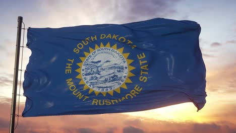 flag of south dakota waving in the wind against deep beautiful sky at sunset