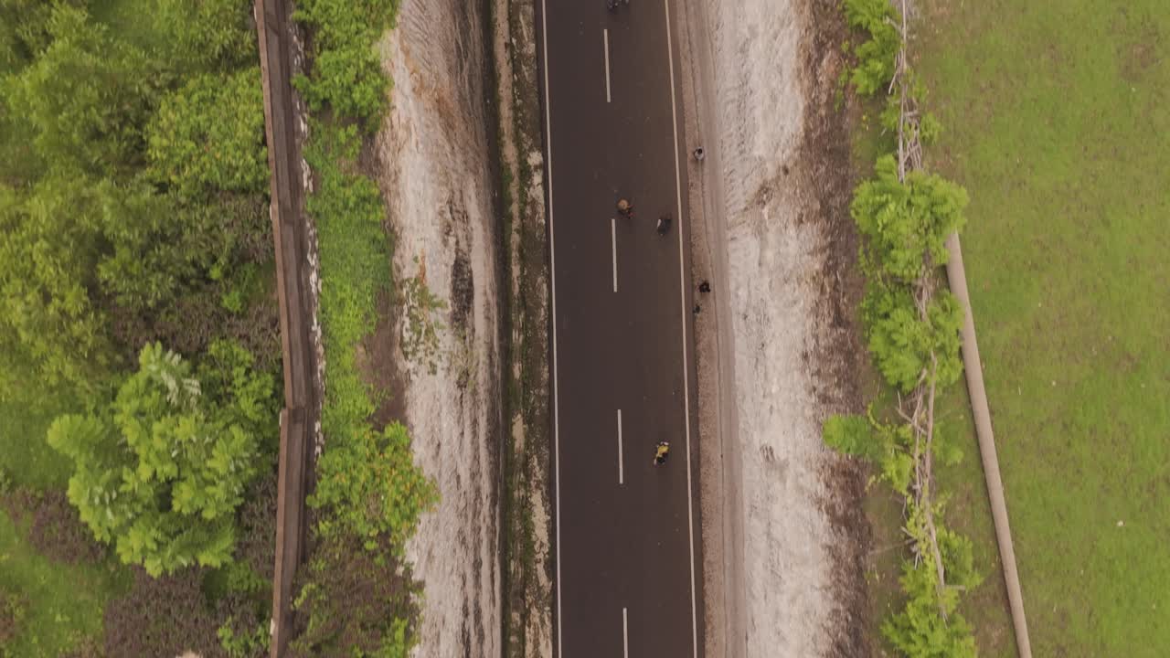 Top-Down Aerial Bird’s-Eye View Flying Over Tanah Barak Cliff in Bali, Indonesia. Stunning Drone Footage Showcasing Dramatic Coastal Landscape and Rock Formations