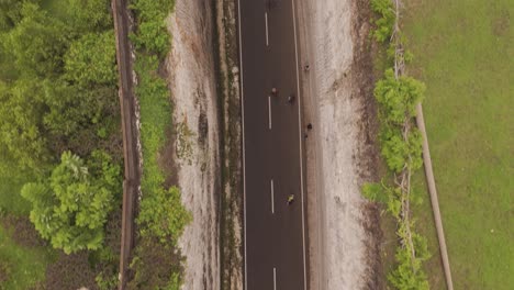 top-down aerial bird’s-eye view flying over tanah barak cliff in bali, indonesia. stunning drone footage showcasing dramatic coastal landscape and rock formations