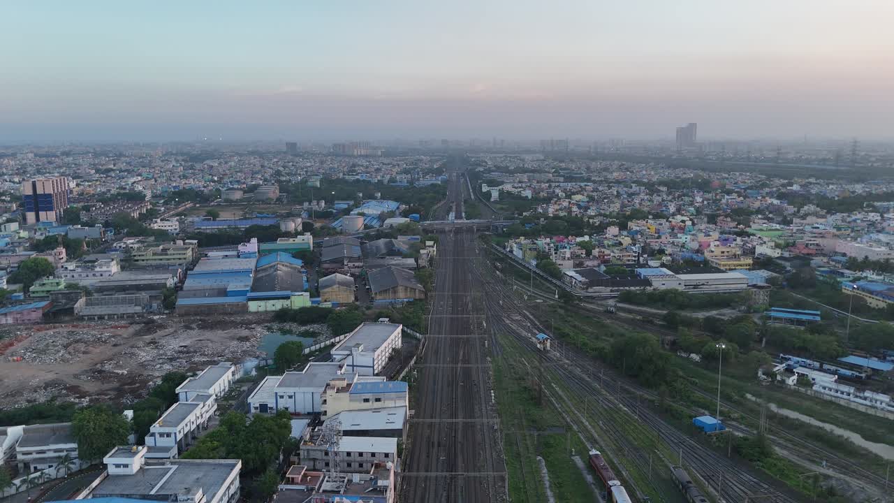 Aerial view of North Chennai cityscape under the warm glow of late afternoon sunlight
