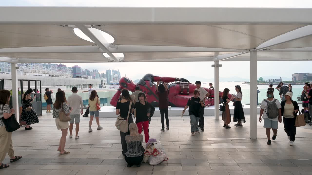 In Hong Kong, locals and tourists visit the 8-meter Deadpool figure, part of Disney’s promotion for the "Deadpool and Wolverine" movie.