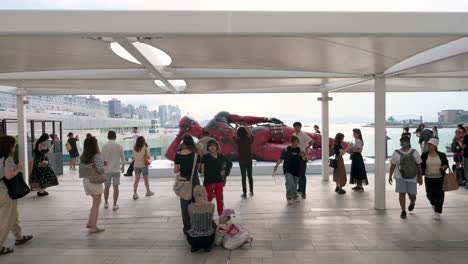 in hong kong, locals and tourists visit the 8-meter deadpool figure, part of disney’s promotion for the "deadpool and wolverine" movie.
