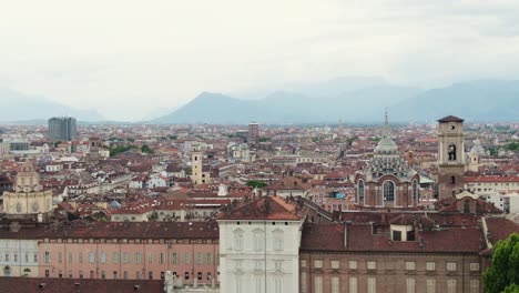 beautiful cityscape and historical buildings of turin, aerial ascend side flying view