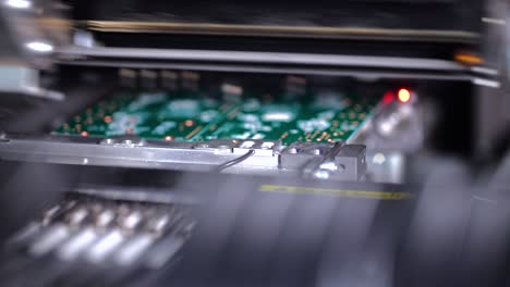 assembling motherboard components by machine close up