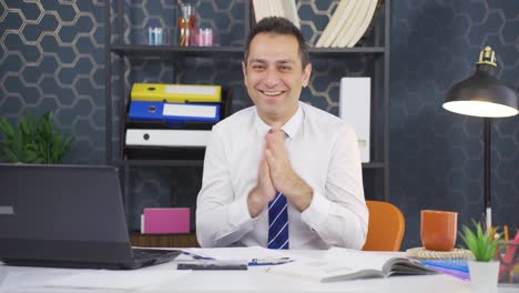 excited businessman clapping at camera.