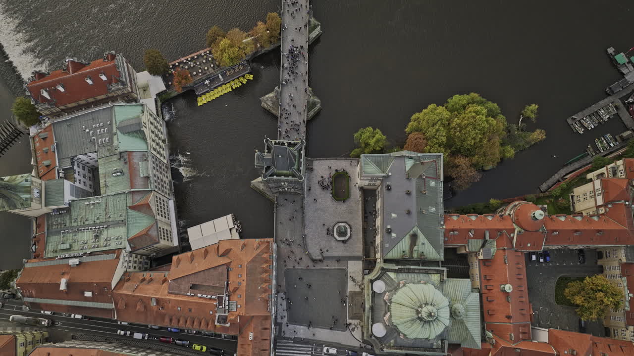 Prague Czechia Aerial v113 cinematic vertical top down view, drone flyover Vltava river along Charles bridge from Old Town towards Mal&aacute; Strana Lesser Town - Shot with Mavic 3 Cine - November 2022