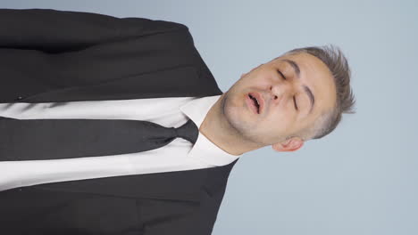 Vertical-video-of-Sneezing-businessman.