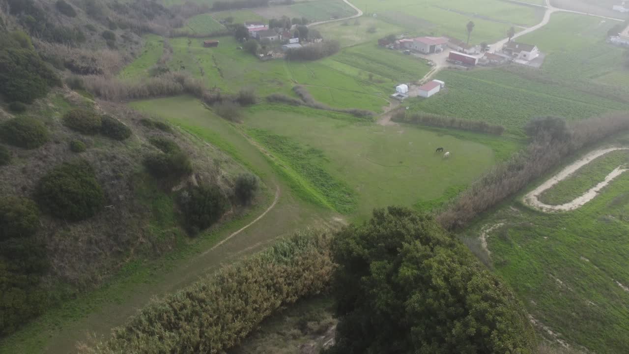 Drone shot flying over a cliff on misty day. Vertigo feeling.