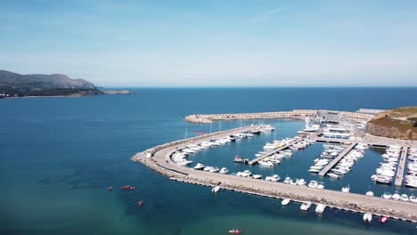 Aerial-drone-view-of-people-kayaking-in-Llançà,-Empordà,-Catalonia,-Spain